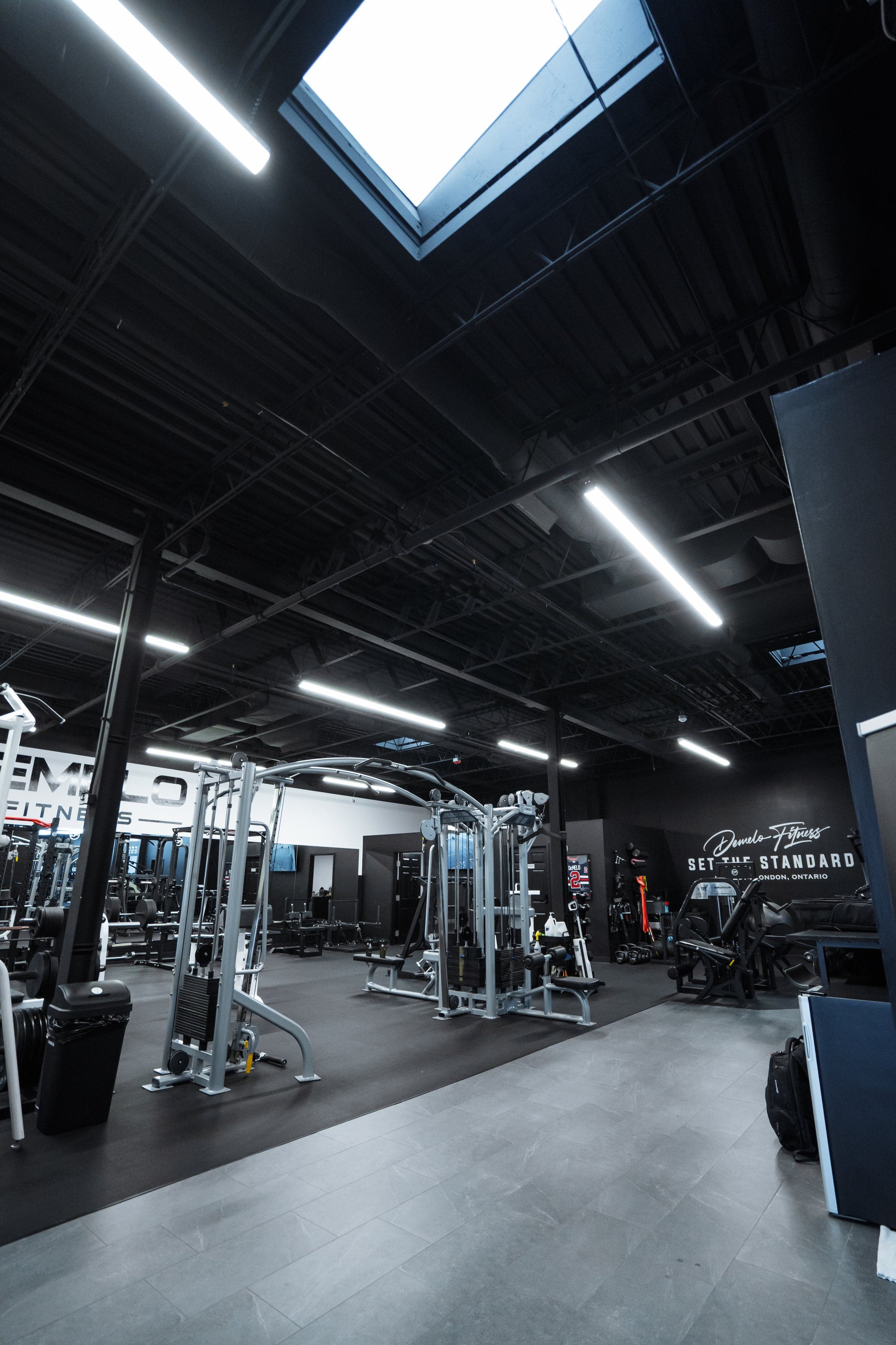 Wide view of the DeMelo Fitness studio with skylight and open training space